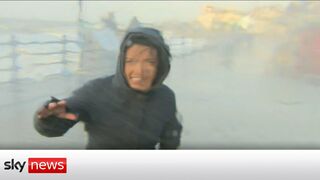 Storm Eunice: Sky correspondent gets hit by wave