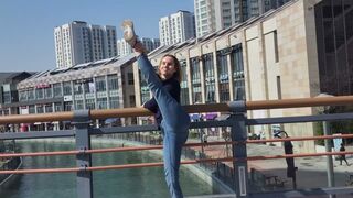 Stretching near river on the bridge