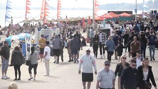 Bournemouth Beach crowded with Easter Sunday visitors during warm weather on the South Coast of UK.