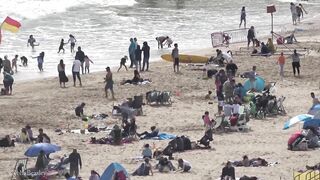 Bournemouth Beach crowded with Easter Sunday visitors during warm weather on the South Coast of UK.