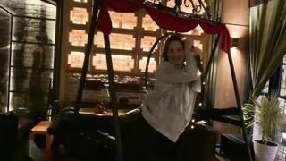 Contortion flexibility art performance. Stretching in a pub