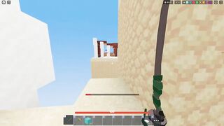 Dominating server with no armor and with a wooden sword in roblox bedwars