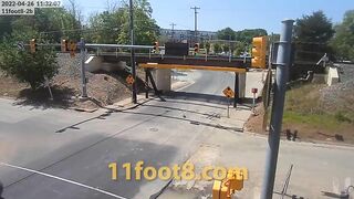 Camper trailer loses equipment at the 11foot8+8 bridge