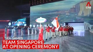 Team Singapore makes its entrance at the 31st SEA Games opening ceremony in Hanoi