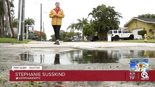 Neighbors stack sandbags, clear storm drains in Lake Worth Beach