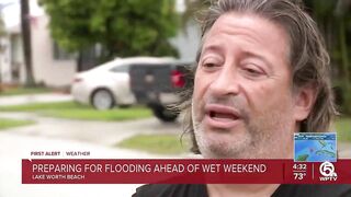 Neighbors stack sandbags, clear storm drains in Lake Worth Beach