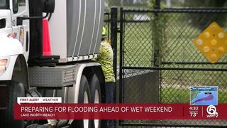 Neighbors stack sandbags, clear storm drains in Lake Worth Beach