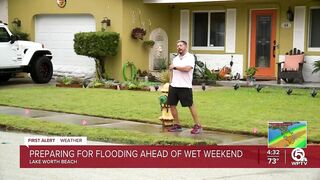 Neighbors stack sandbags, clear storm drains in Lake Worth Beach