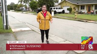 Neighbors stack sandbags, clear storm drains in Lake Worth Beach