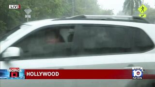 Hollywood Beach rescue vehicles help cars stuck in flooding