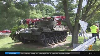 Police officers transport tank to Clifton, N.J., for pull challenge