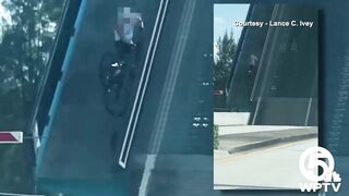 Video shows bicyclist cling to North Palm Beach bridge as it rises