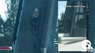 Video shows bicyclist cling to North Palm Beach bridge as it rises