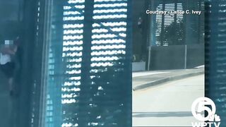 Video shows bicyclist cling to North Palm Beach bridge as it rises