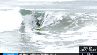 Onlookers gather at The Wedge in Newport Beach as high-powered swells hit SoCal