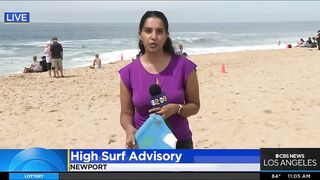 Onlookers gather at The Wedge in Newport Beach as high-powered swells hit SoCal