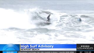 Onlookers gather at The Wedge in Newport Beach as high-powered swells hit SoCal