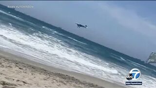 Horrified beachgoers watch as plane crashes into the ocean at Huntington Beach | ABC7