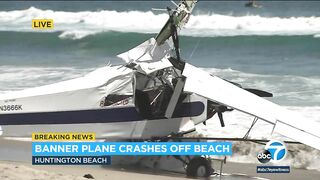 Horrified beachgoers watch as plane crashes into the ocean at Huntington Beach | ABC7