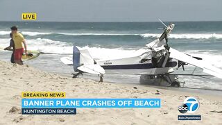 Horrified beachgoers watch as plane crashes into the ocean at Huntington Beach | ABC7