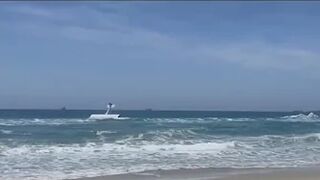 Video shows small plane crash into ocean in Huntington Beach