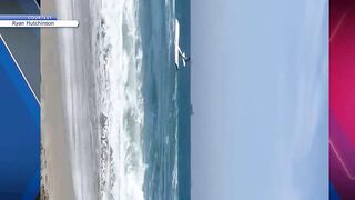 Watch: Plane crashes into ocean in Huntington Beach