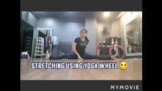 stretching using yoga wheel