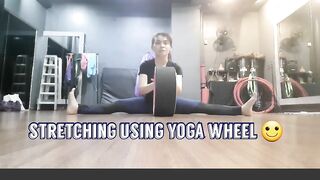 stretching using yoga wheel