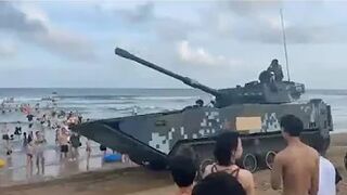 Huge tanks patrol over Chinese beach in chilling 'show of force' to the US and Taiwan!!!