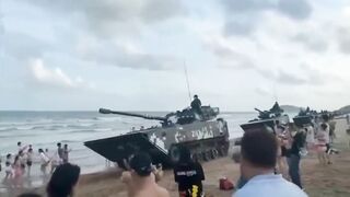 Huge tanks patrol over Chinese beach in chilling 'show of force' to the US and Taiwan!!!