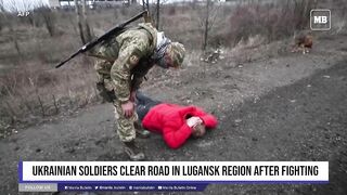 Ukrainian soldiers clear road in Lugansk region after fighting