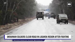 Ukrainian soldiers clear road in Lugansk region after fighting