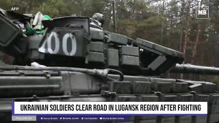 Ukrainian soldiers clear road in Lugansk region after fighting