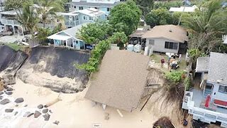 North Shore home collapses onto the beach