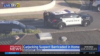 Carjacking suspect barricaded in Newport Beach home