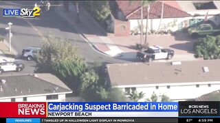 Carjacking suspect barricaded in Newport Beach home