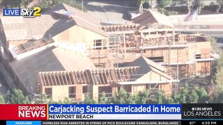 Carjacking suspect barricaded in Newport Beach home