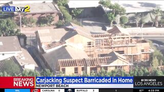 Carjacking suspect barricaded in Newport Beach home