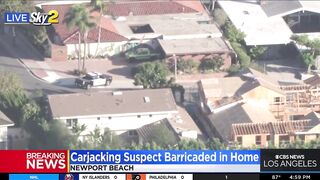 Carjacking suspect barricaded in Newport Beach home