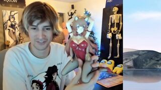 xQc showing his Anime figurine