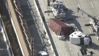 Big rig overturns on car on 405 Freeway in Seal Beach