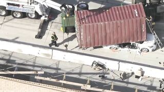 Big rig overturns on car on 405 Freeway in Seal Beach