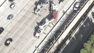 Big rig overturns on car on 405 Freeway in Seal Beach