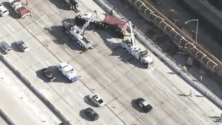 Big rig overturns on car on 405 Freeway in Seal Beach