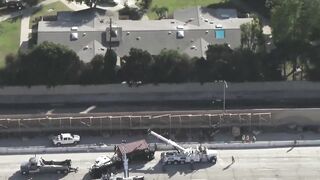 Big rig overturns on car on 405 Freeway in Seal Beach