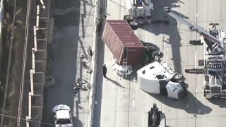 Big rig overturns on car on 405 Freeway in Seal Beach