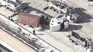 Big rig overturns on car on 405 Freeway in Seal Beach