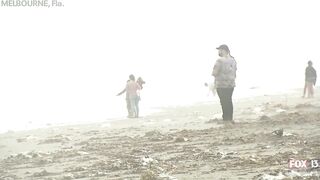 Hurricane Nicole: Weather tourists on Indialantic Beach in Melbourne, Florida