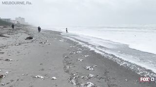 Hurricane Nicole: Weather tourists on Indialantic Beach in Melbourne, Florida