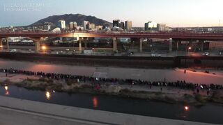 DRONE shows long queue of migrants stretching miles along US border wall